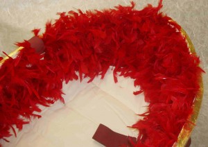 Gold Ecopod with red feathers
